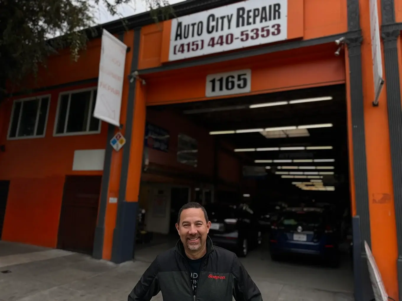The owner of Auto City Repair outside the shop on Folsom Street in San Francisco's SoMa